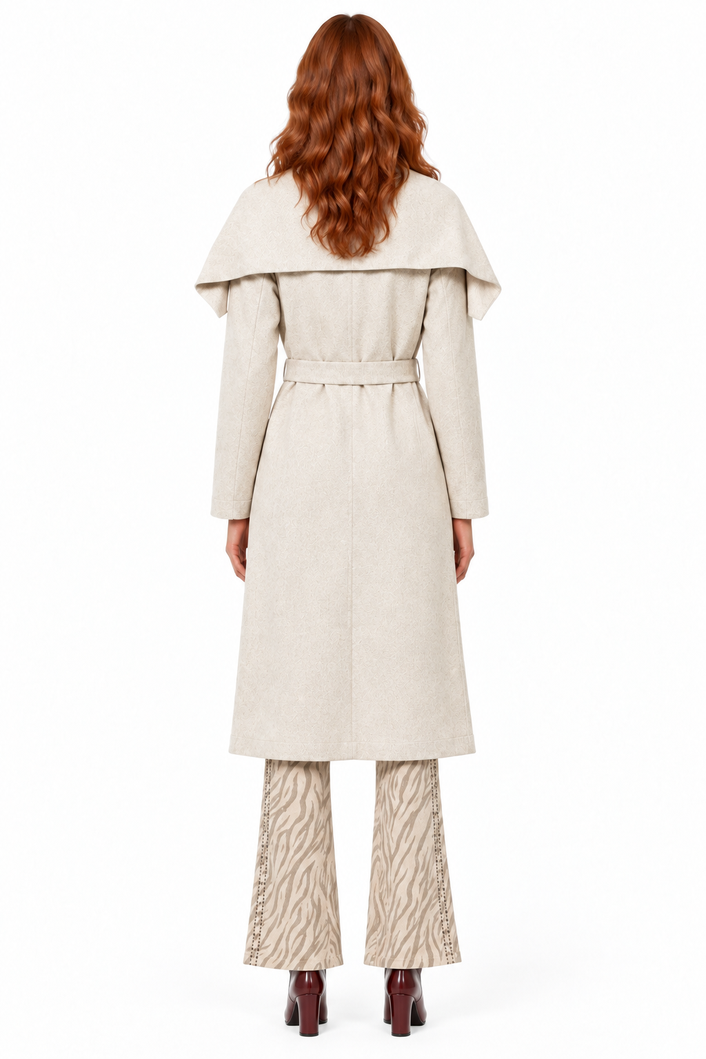 Back view of the redhead model in the coat and Beciga pants