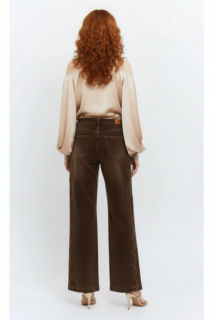Back view showing the scalloped seams and welt pockets