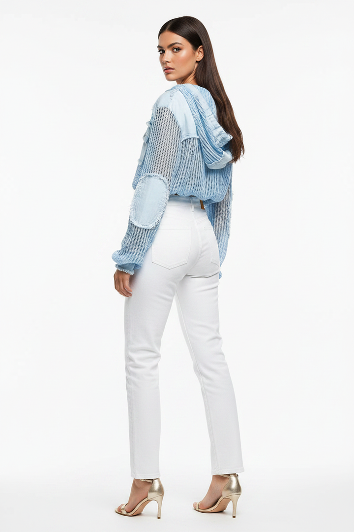 Dark hair Beciga model, back pose, white jeans + blue mixed-media jacket