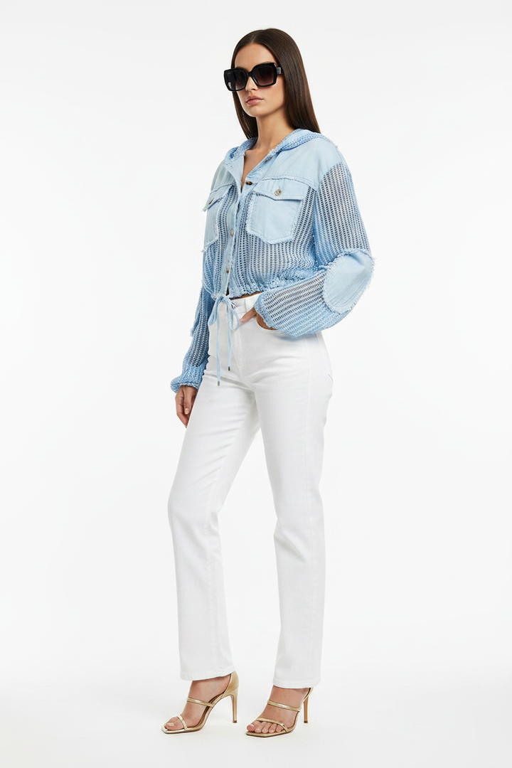 Dark hair Beciga model, back, white jeans + blue mixed-media jacket