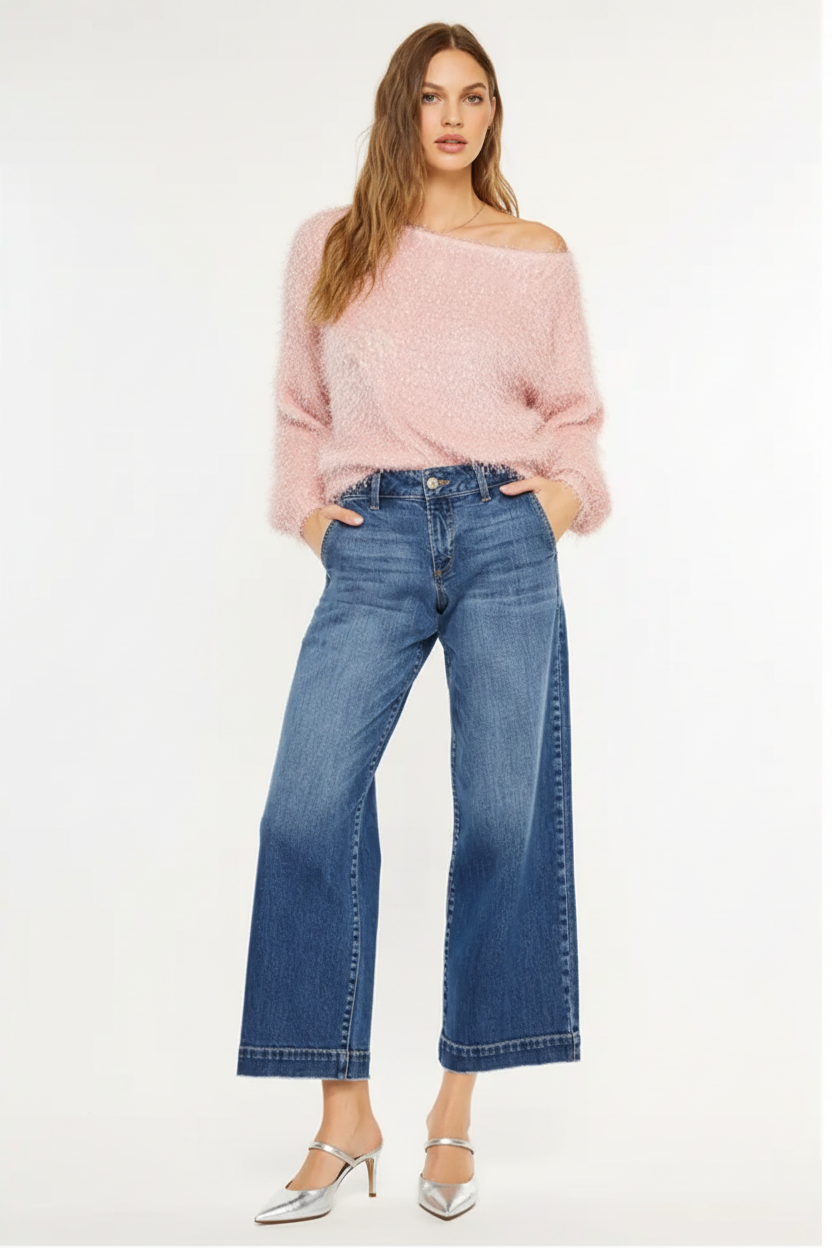 Front view with pink sweater, hands in pockets, and stylish shoes