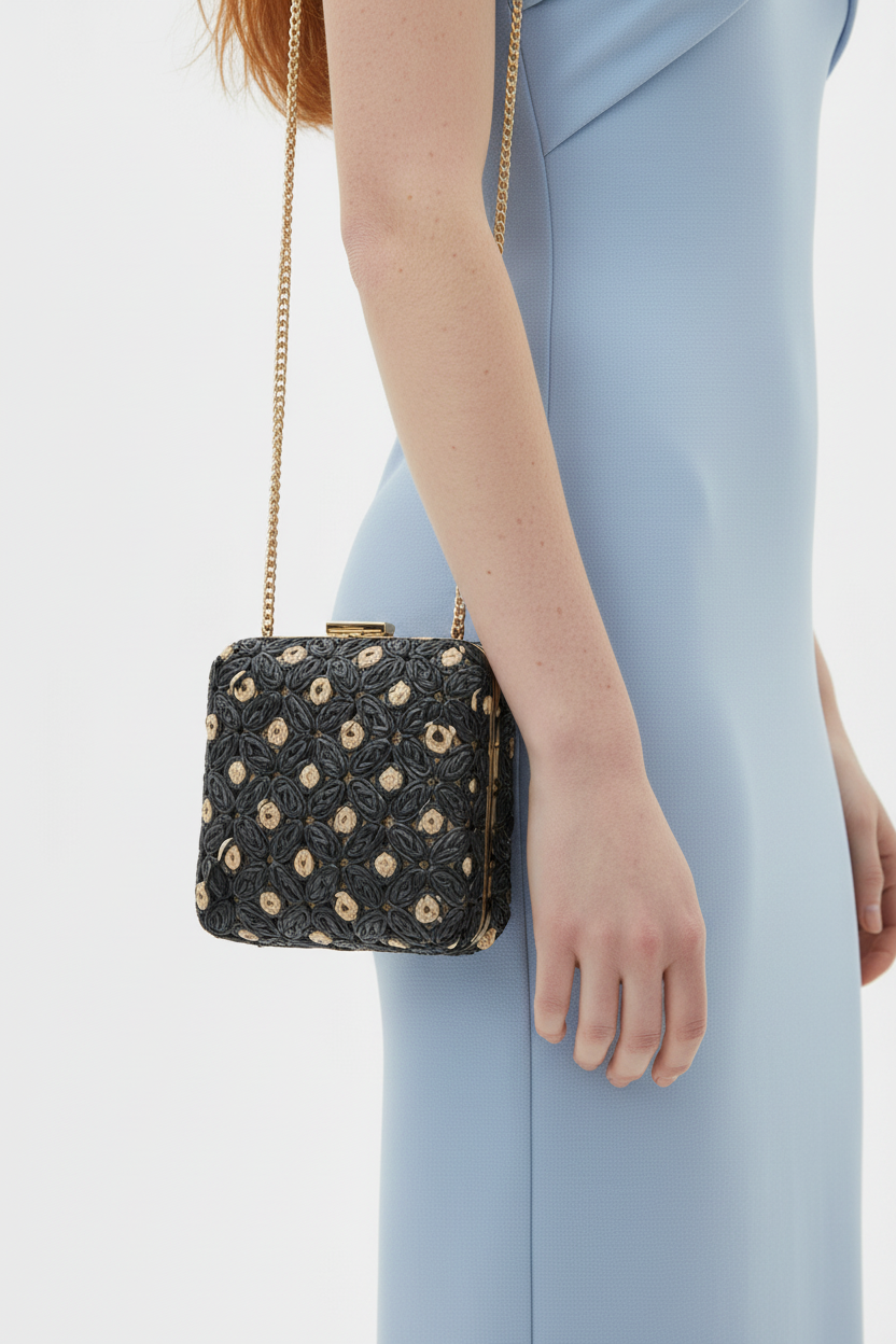 Close-up of Samantha Evening Bag on Beciga red hair model in blue twist-knot dress