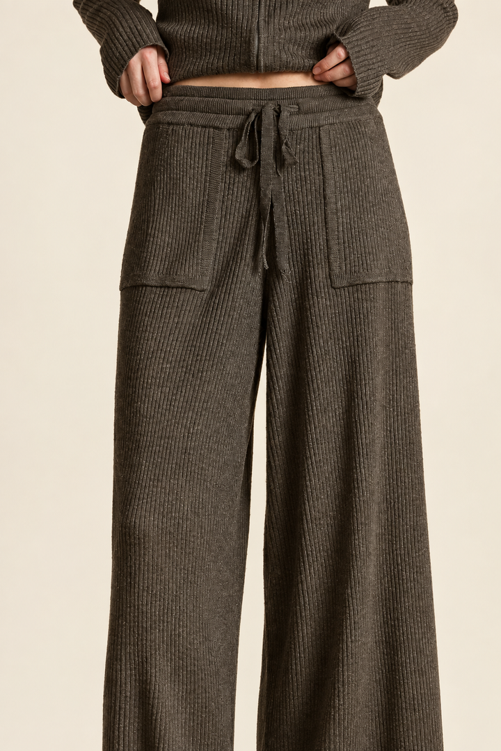 Close-up of Espresso ribbed knitted pants drawstring waistband and front patch pockets