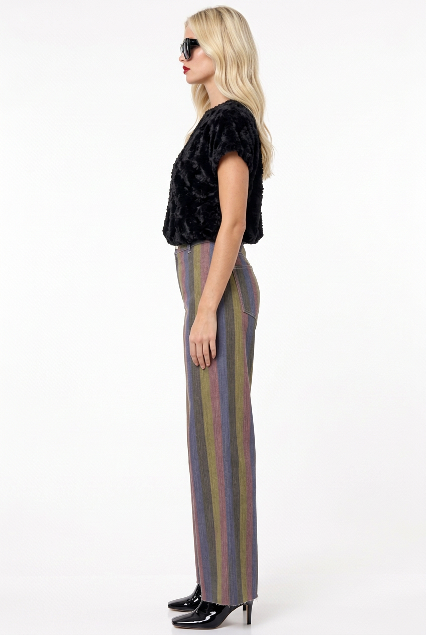 Tiffany in multicolor panel pants with black plush top and patent booties, side view