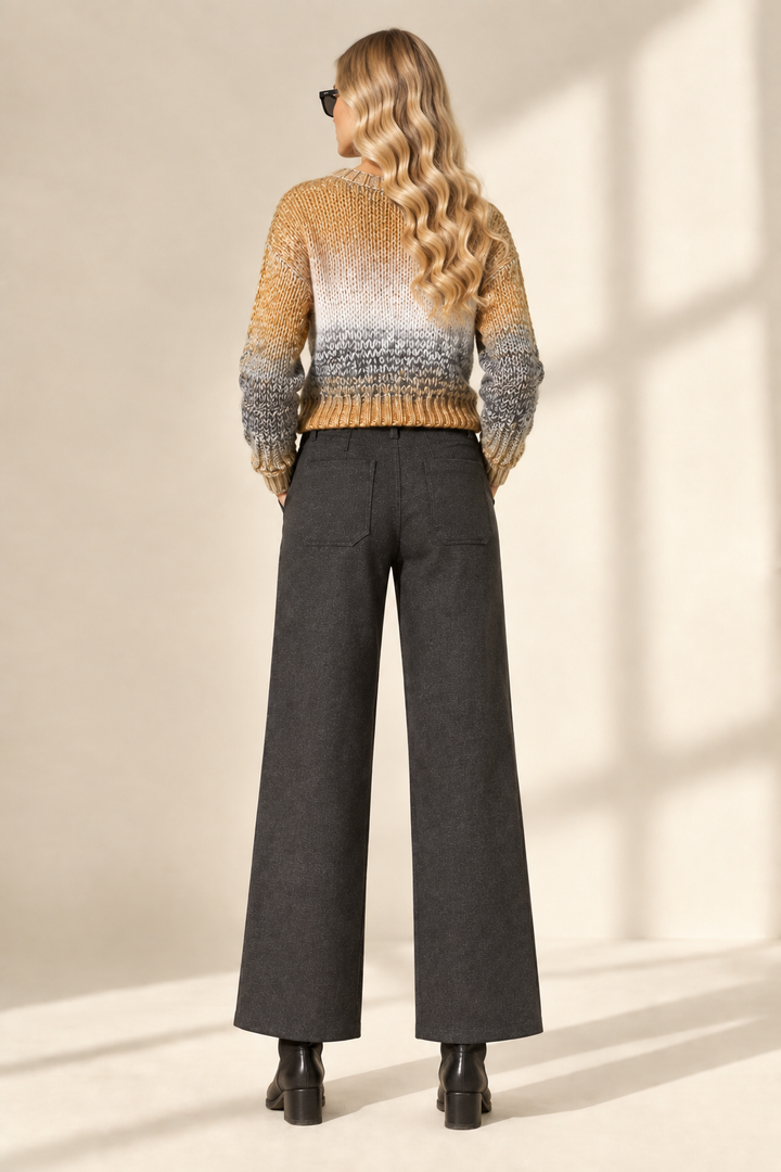 Back view of Tracey wearing charcoal Ponte Fabric Crop Pants and color-block sweater
