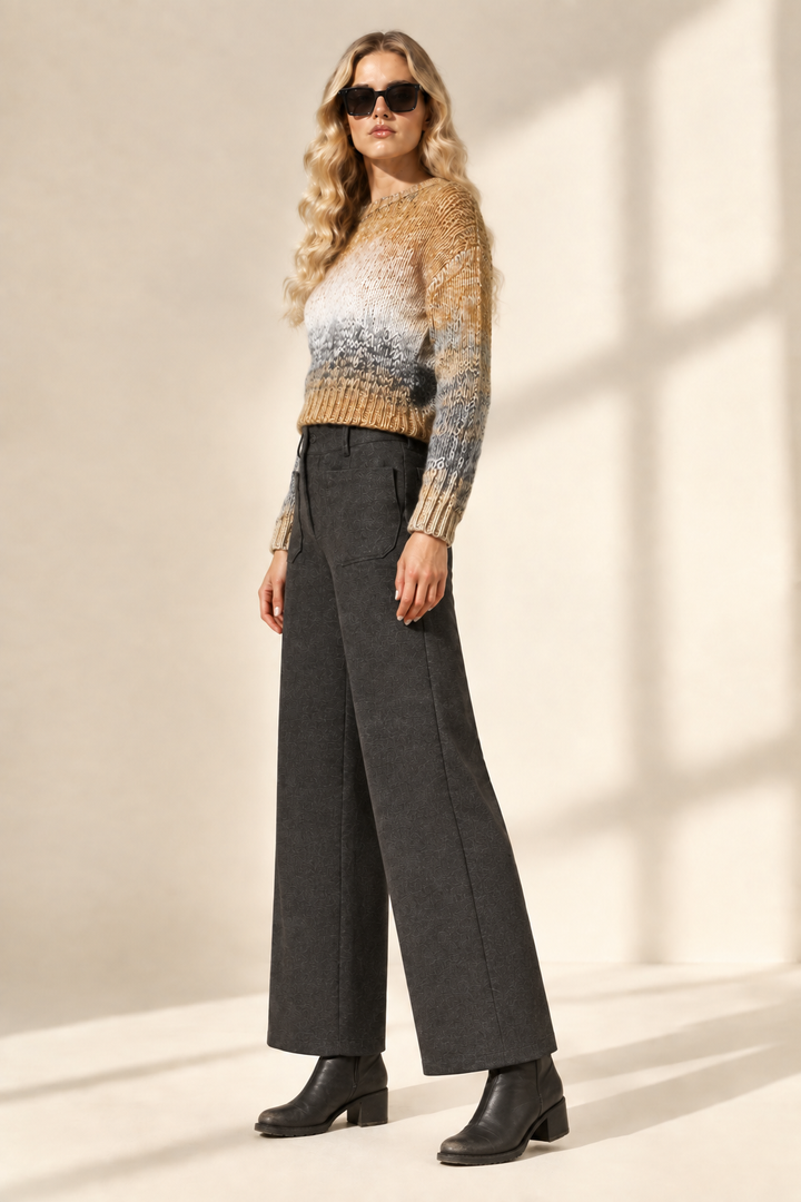 Side view of Tracey in charcoal Ponte Fabric Crop Pants and black chunky booties