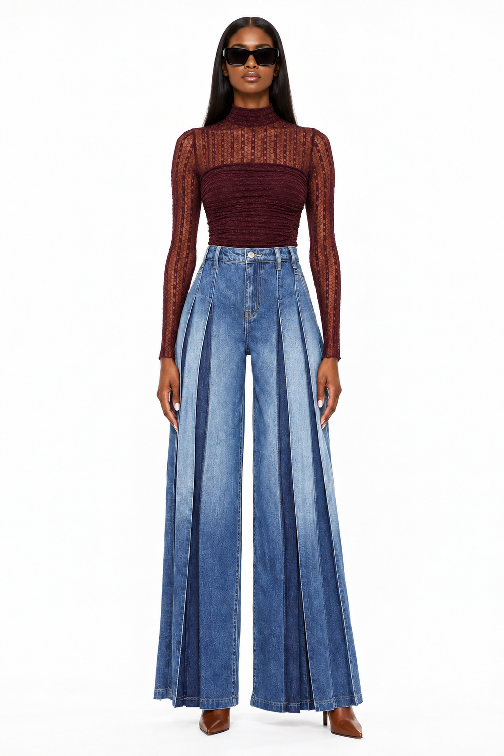 Front view of model in dark-wash high-rise pleated wide-leg jeans, burgundy bodysuit and cognac heels