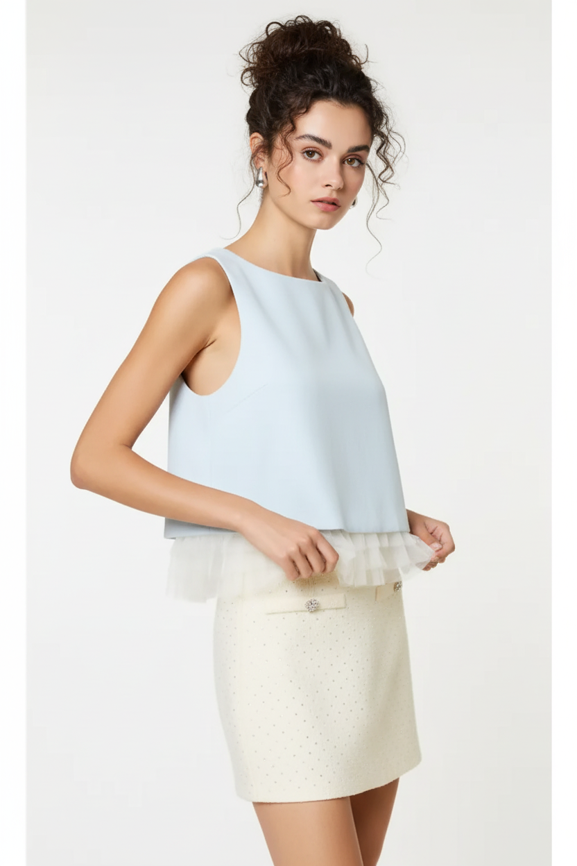 Baby blue sleeveless ruffle hem top - three-quarter view with dark curly messy bun model on white background