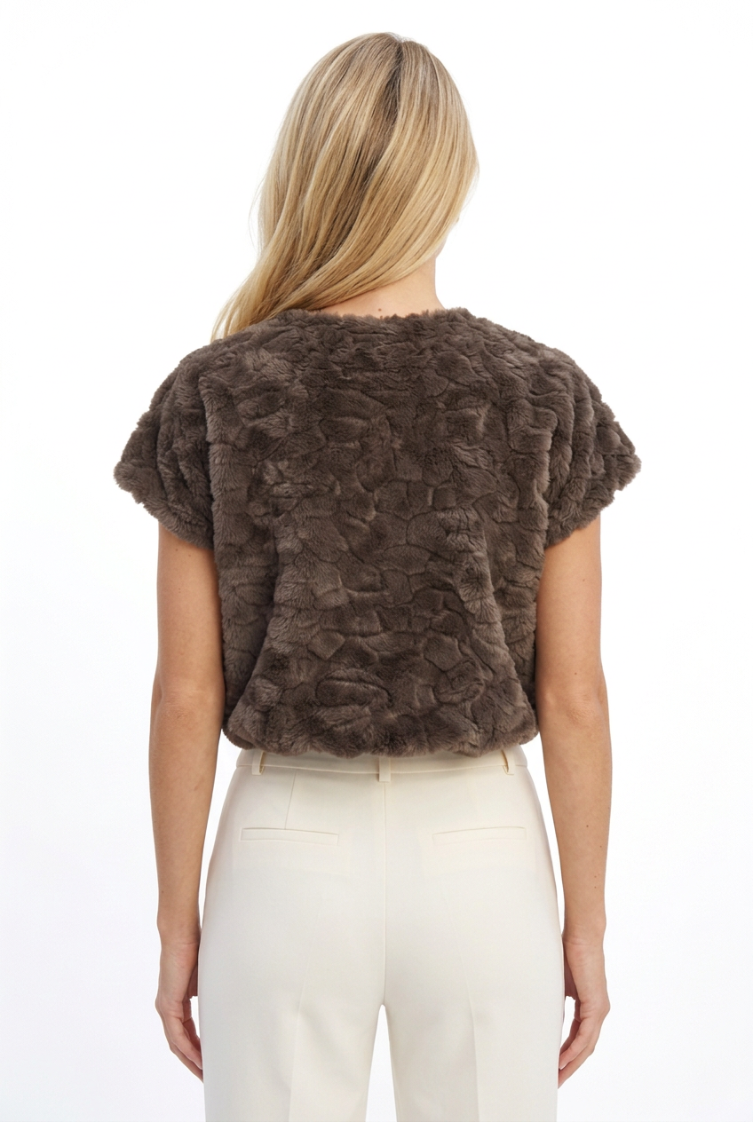 Back view of Tricia wearing the mocha plush textured faux fur top.