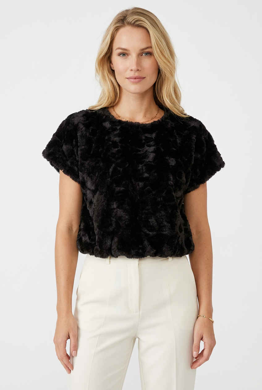 Tricia modeling the black plush textured faux fur top without glasses.