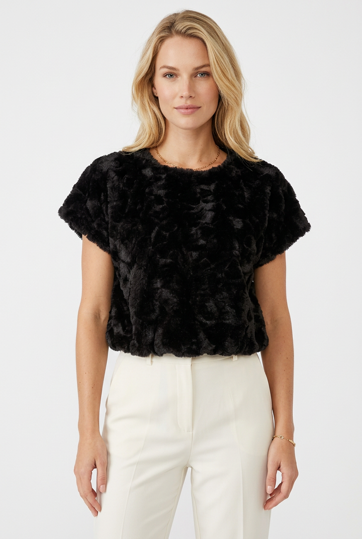 Tricia modeling the black plush textured faux fur top without glasses.