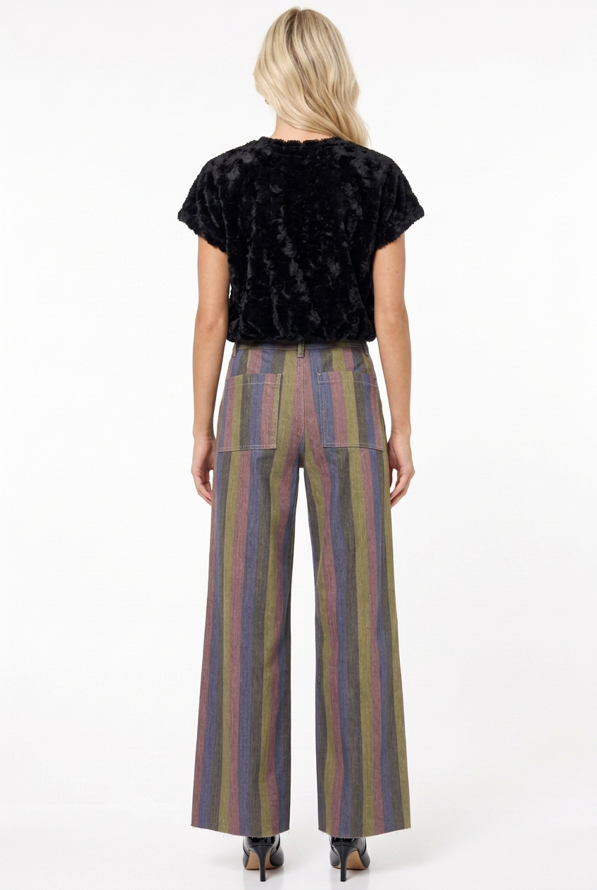 Tiffany in multicolor panel pants with black plush top and patent booties, back view