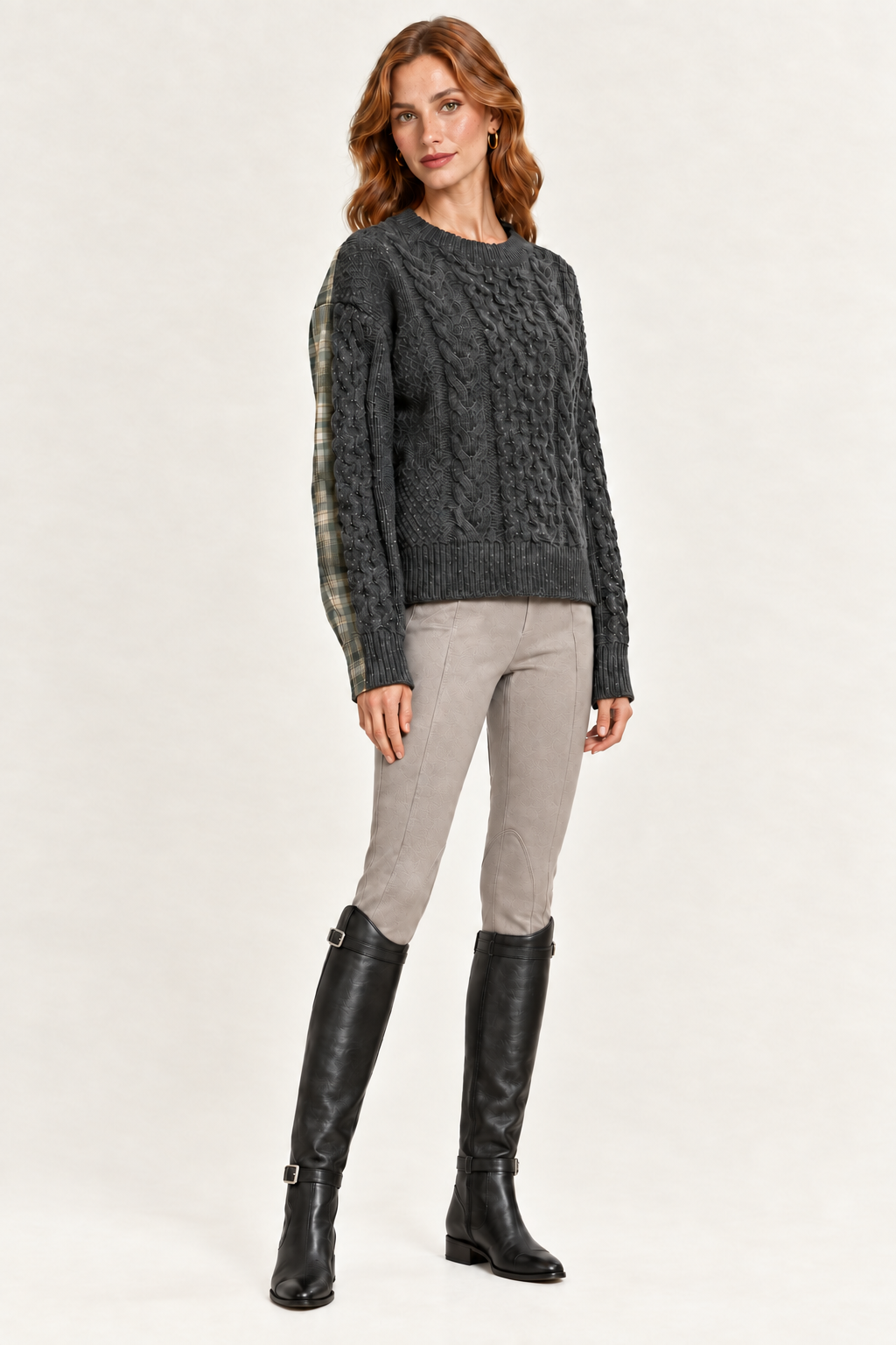Rowan wearing charcoal and olive mixed-media cable-knit sweater, three-quarter view
