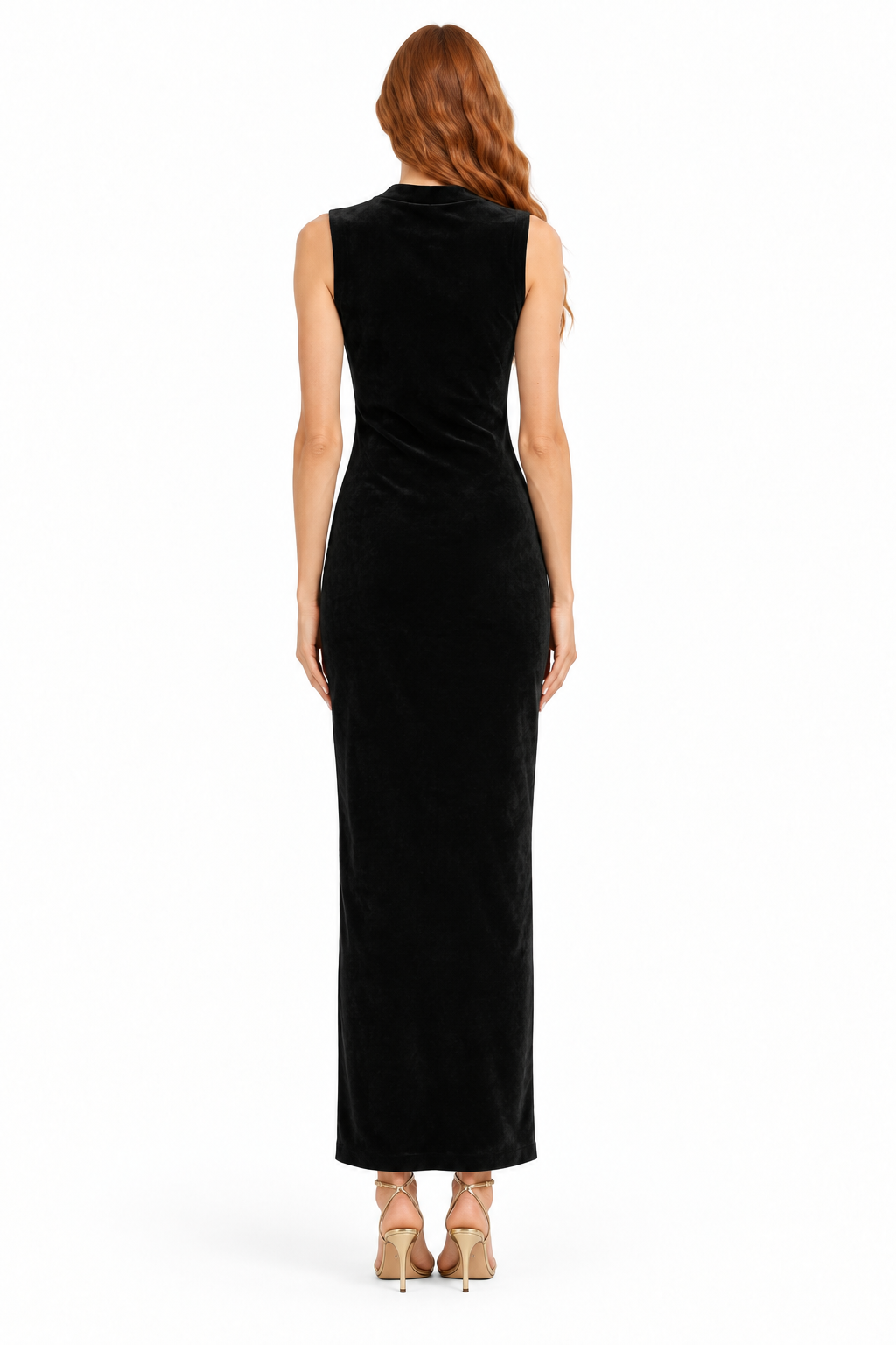 Back view of black sleeveless velvet maxi dress on redhead Beciga model with gold strappy heels