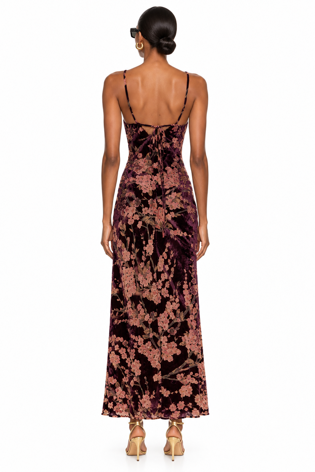 Back view of burgundy floral velvet maxi dress showing spaghetti straps and back tie