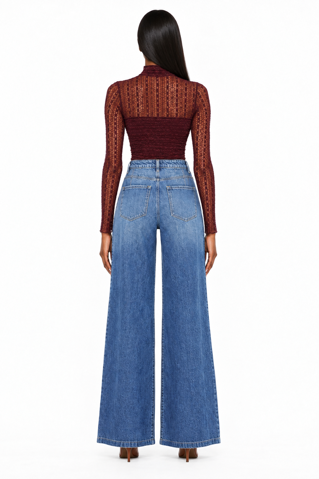 Back view showing pockets and wide legs of dark-wash high-rise jeans on model with burgundy bodysuit