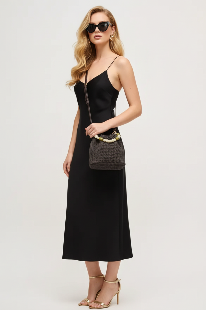 Beciga signature model wearing charcoal crochet bucket bag as crossbody