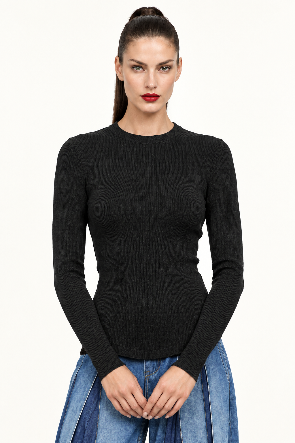 Sloane front waist-up view in black ribbed long sleeve top with blue jeans