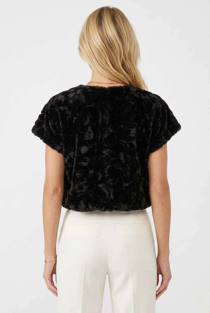 Back view of Tricia wearing the black plush textured faux fur top.