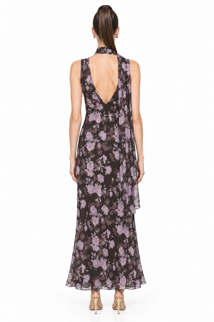 Back view of Sloane wearing Noelle floral chiffon maxi dress showing low V back and matching scarf