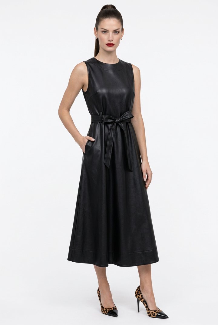 Front view of black faux leather sleeveless belted dress on Sloane