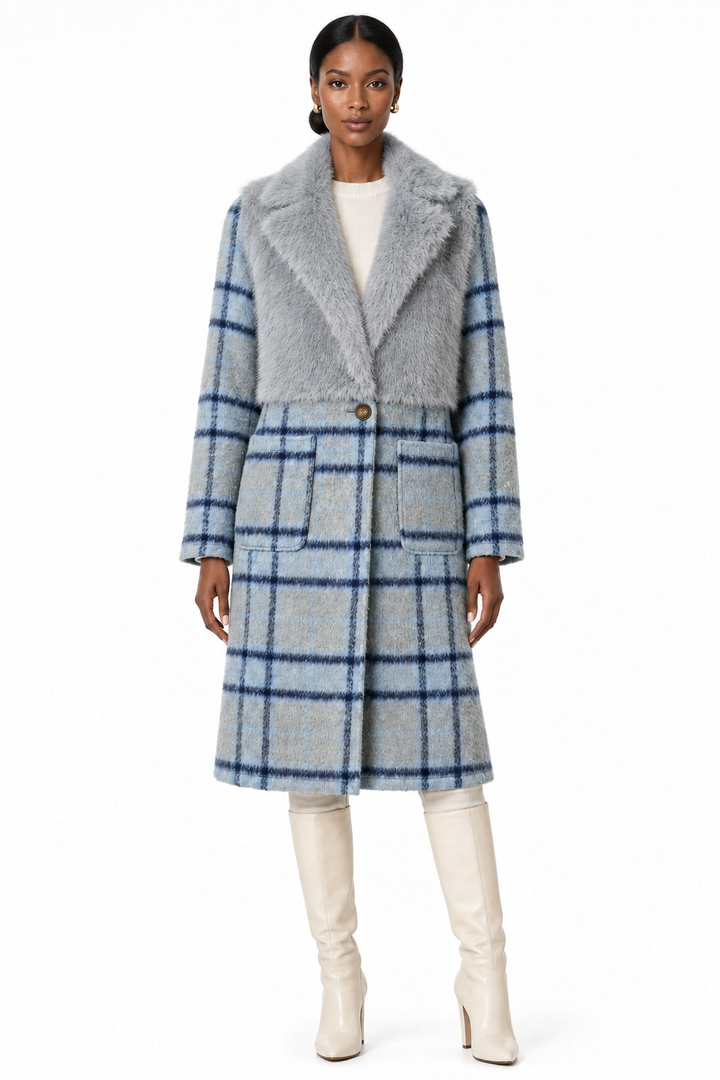 Model wearing cloudy blue faux-fur and plaid coat with cream knee-high boots, front view