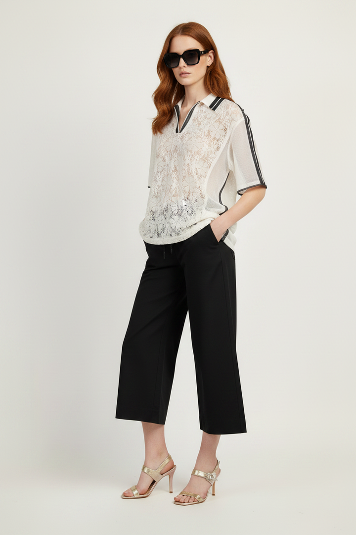 Redhead model, close-up crop, black trousers