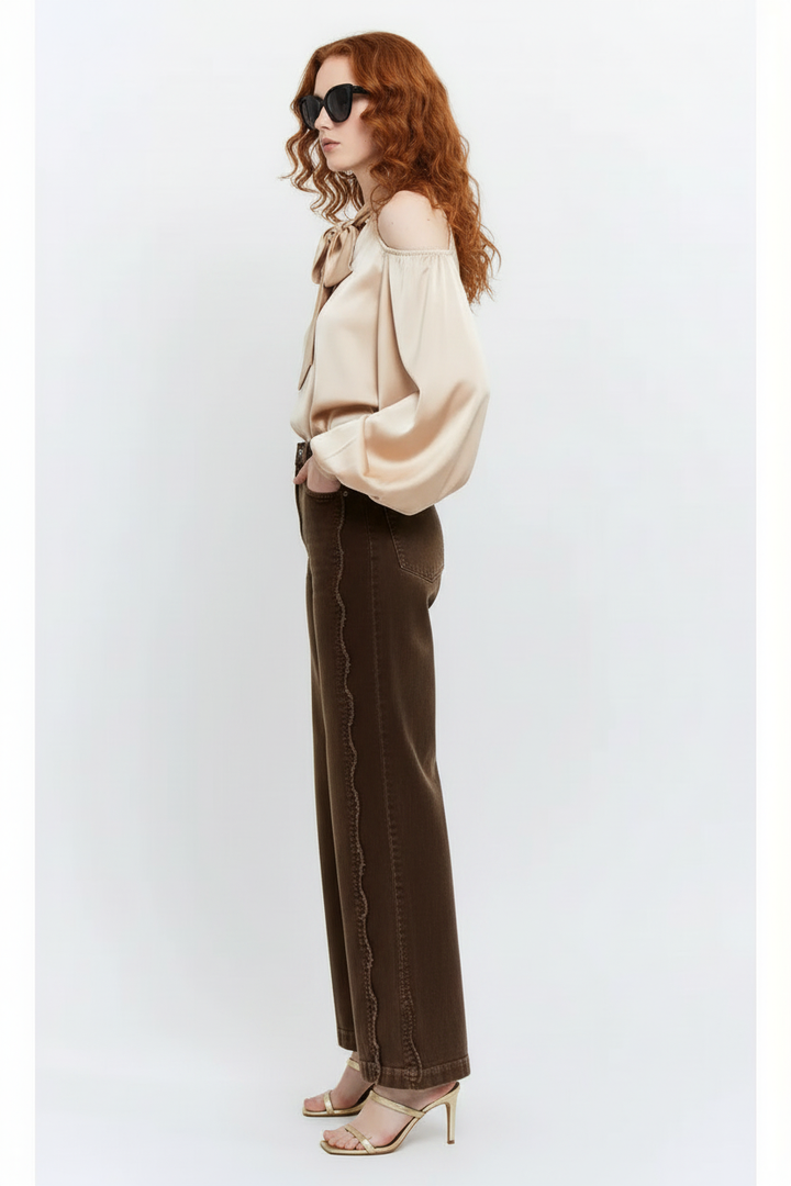 Side view highlighting the scalloped outer seam