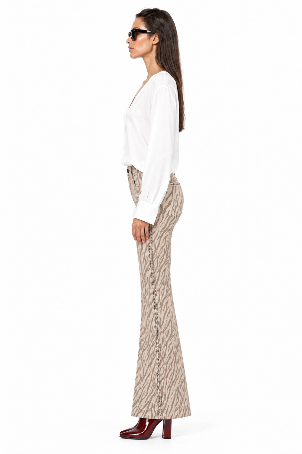 Side view of Beciga zebra-print jeans