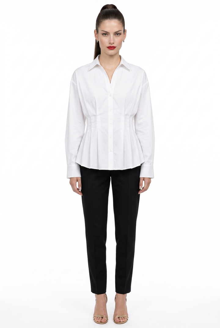 Sloane wearing the white pleated poplin button-down top