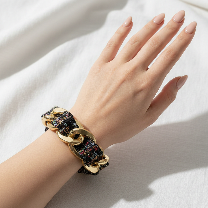 Tweed fabric bracelet on manicured wrist
